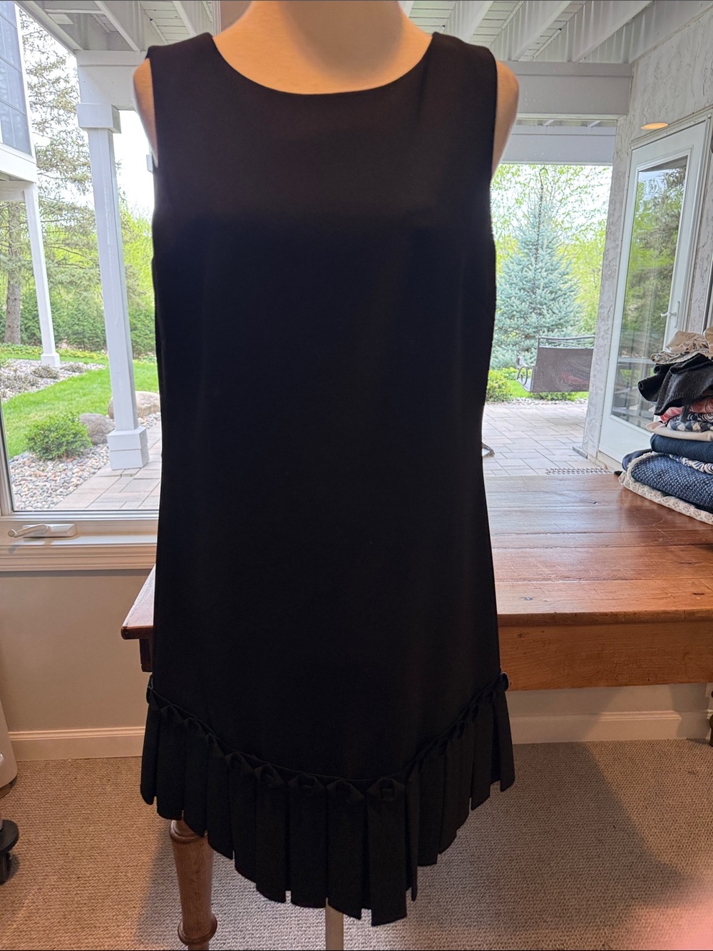 Sleeveless Black Mini Dress with Pleated Hem